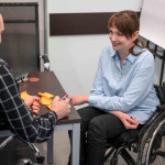 Smiley businesswoman in wheelchair