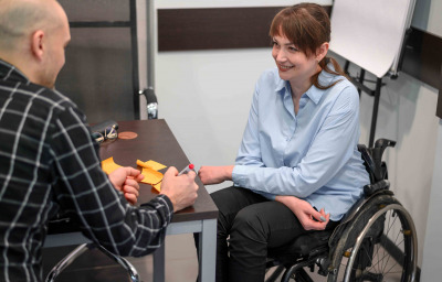 Smiley businesswoman in wheelchair