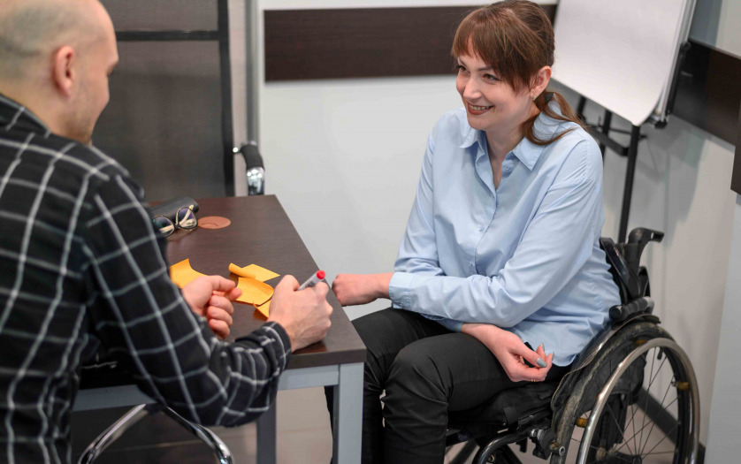 Smiley businesswoman in wheelchair