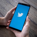 Smartphone with twitter logo on screen