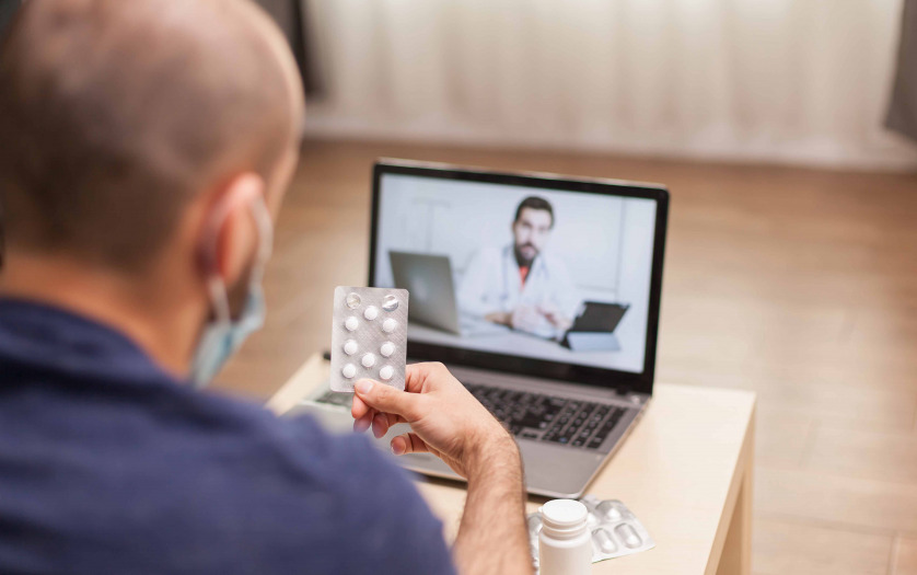 Adult man on video conference with doctor