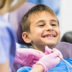 boy going through dental treatment in clinic