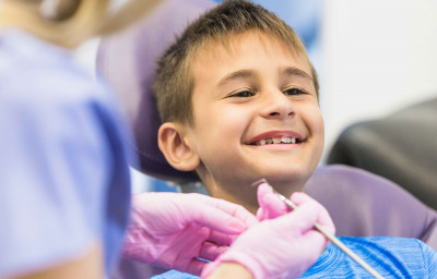 boy going through dental treatment in clinic
