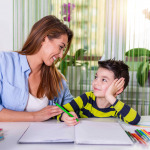 Mother helping with homework to her son