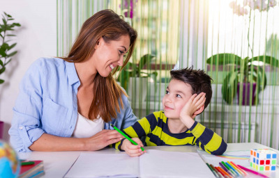 Mother helping with homework to her son