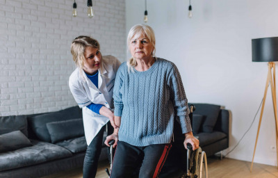 Woman in old age home with wheelchair