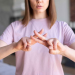 a woman learning sign language
