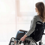 Portrait of women in wheelchair looking away