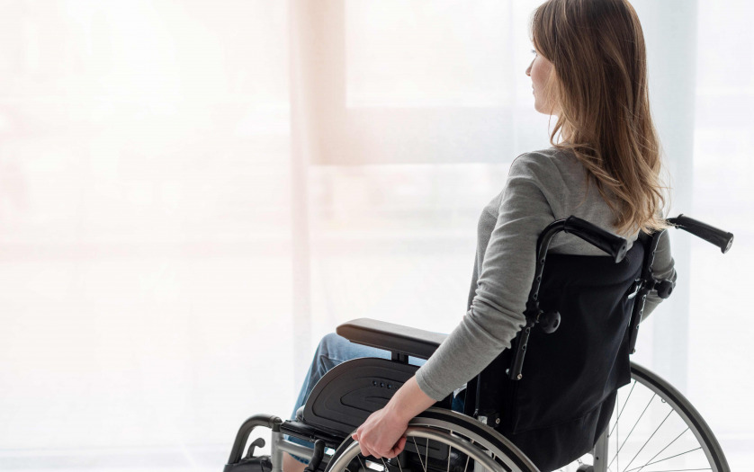 Portrait of women in wheelchair looking away