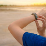Young woman touching smart Wearable band