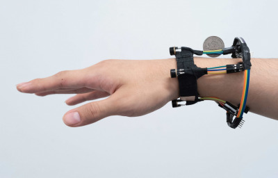 a person hand wearing the device