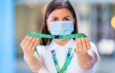 airport staff holding sunflower lanyard