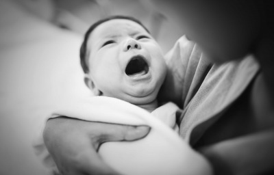 A newborn baby screaming out loud