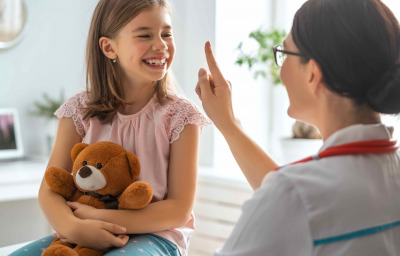 Doctor examining a child in a hospital