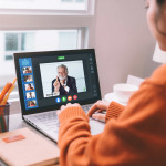 Backside view of business woman talking together on online meeting