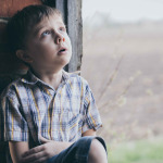 Portrait of little boy outdoors at the day time.
