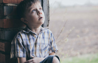 Portrait of little boy outdoors at the day time.