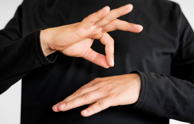 Close-up interpreter teaching sign language