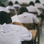 Students doing test in classroom