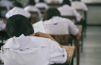 Students doing test in classroom