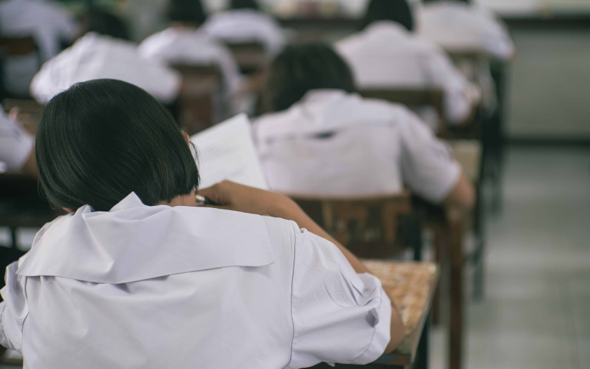 Students doing test in classroom