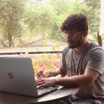 young Indian doing work from home.