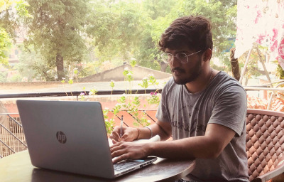 young Indian doing work from home.