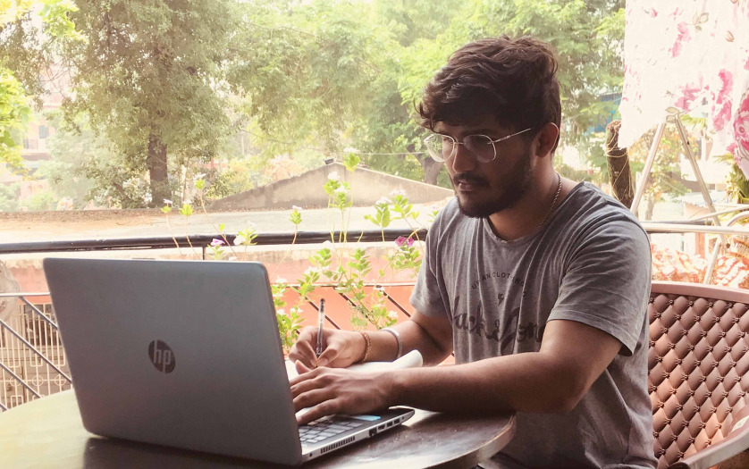 young Indian doing work from home.