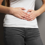 young woman with bellyache or menstrual cramps