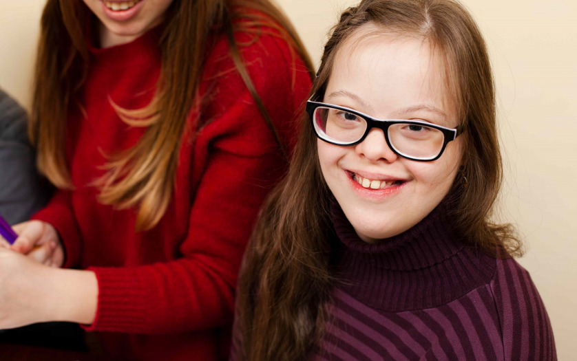High angle of happy girl with down syndrome posing