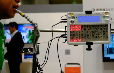 a person showing a demo of mouth joystick