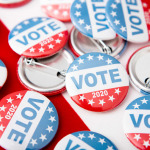 United States of America election pin buttons on US flag background