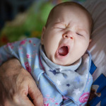 Baby girl yawning