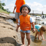 boy with autism with family at the river bank