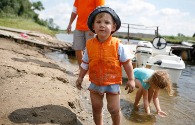 boy with autism with family at the river bank