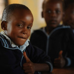 smiling african boy in the classroom