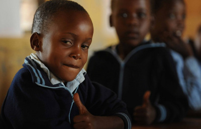 smiling african boy in the classroom