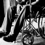 man in wheelchair at home