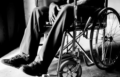 man in wheelchair at home