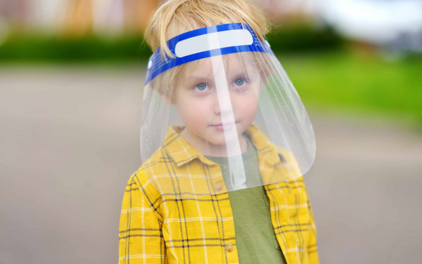 a child with disability with face shield
