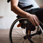 man in wheelchair at home