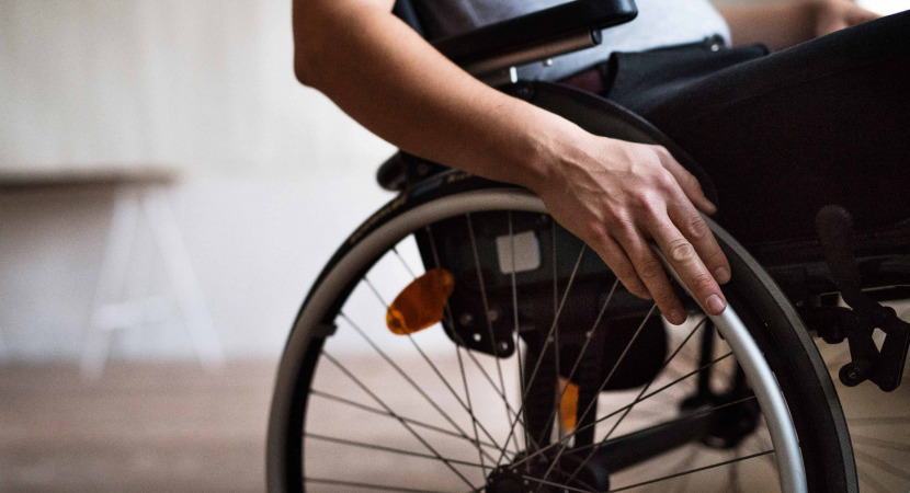 man in wheelchair at home