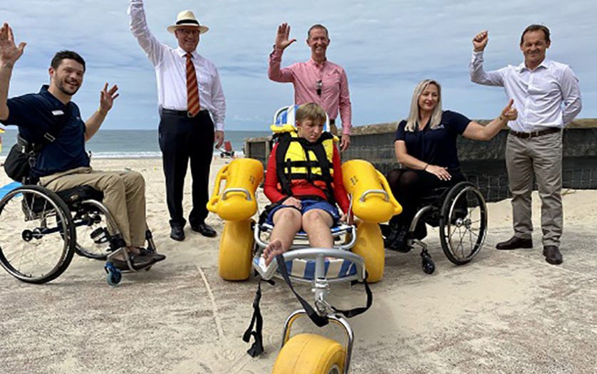 (L-R) Lachy Chapman, Spinal Life Australia, Mayor Mark Jamieson, Compass CEO David Dangerfield, Compass trainee Cole Kienzle (front, in beach wheelchair), Katie Hammond, Spinal Life Australia and Division 2 Councillor Terry Landsberg.