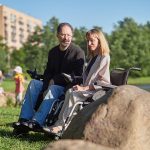 a photo of man and woman in wheelchair