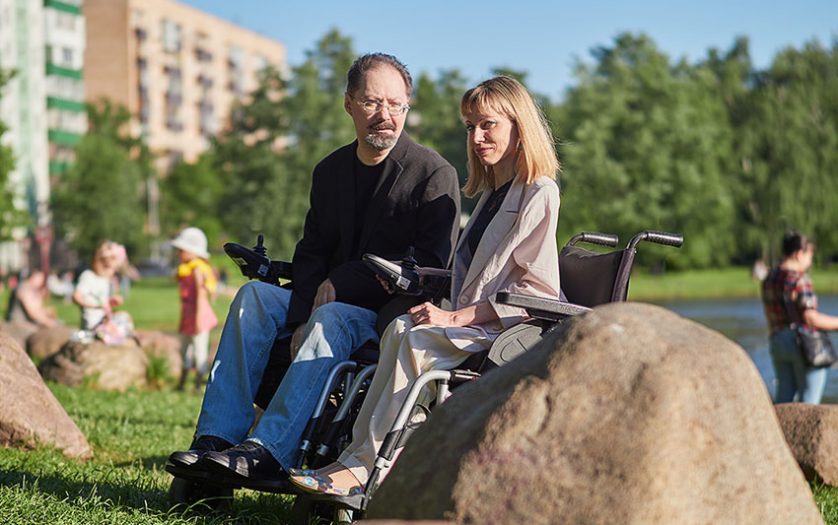 a photo of man and woman in wheelchair