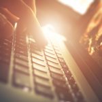 Hand on the Laptop Computer