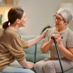 Elderly patient and caregiver spending time together