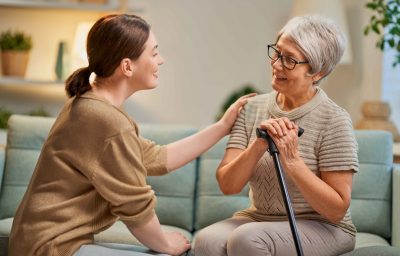 Elderly patient and caregiver spending time together