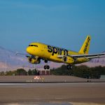 A Spirit Airlines Airbus aircraft landing at Las Vegas McCarran International Airport.