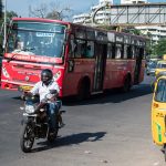 Traffic with public transport red bus in Chennai, India